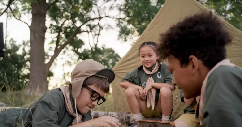 Children playing a board game at a campsite — illustrative activity for all inclusive east coast family resorts.