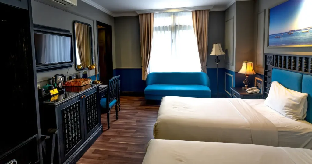 Hotel room with two beds and a sofa — illustrative accommodation for all inclusive family resorts east coast.