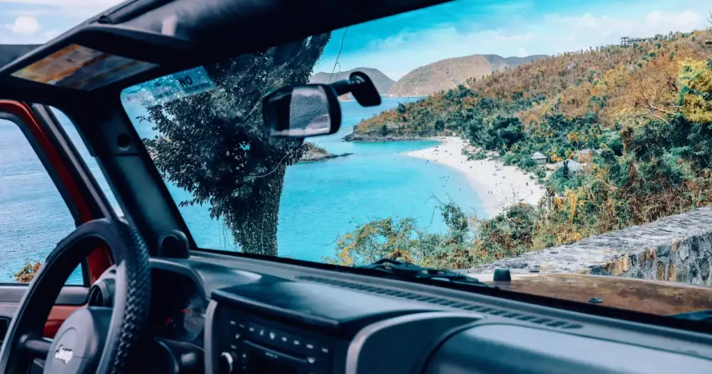 Beach view through a vehicle windshield for the all inclusive family resorts US Virgin Islands guide