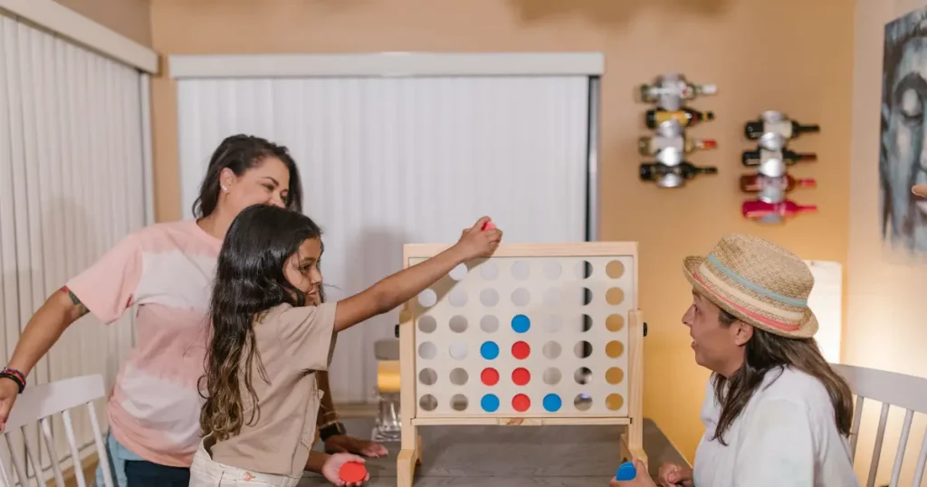 Family playing Connect Four together — illustrative activity for all inclusive resorts east coast for families.