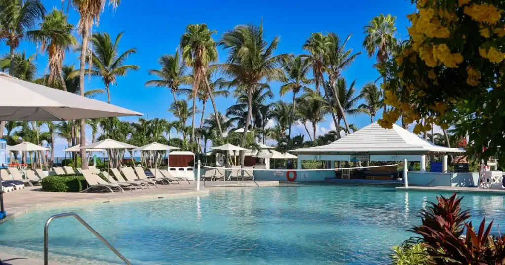 Best family friendly Caribbean resorts: pool surrounded by palm trees at Beaches Turks & Caicos