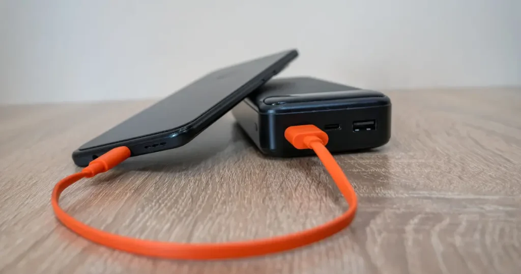 Things to bring on a long flight including charging cables and a power bank